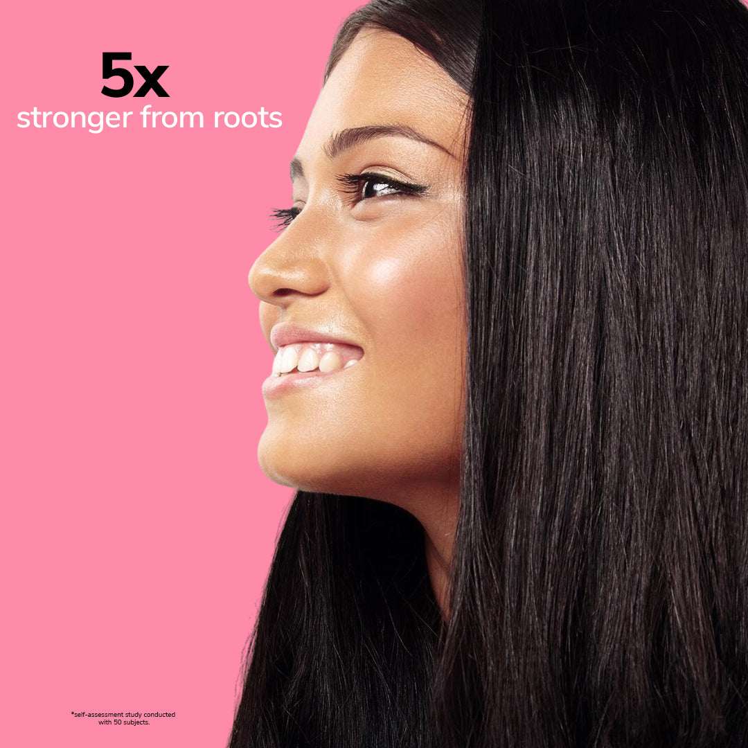 Woman with long dark hair on a pink background with text &