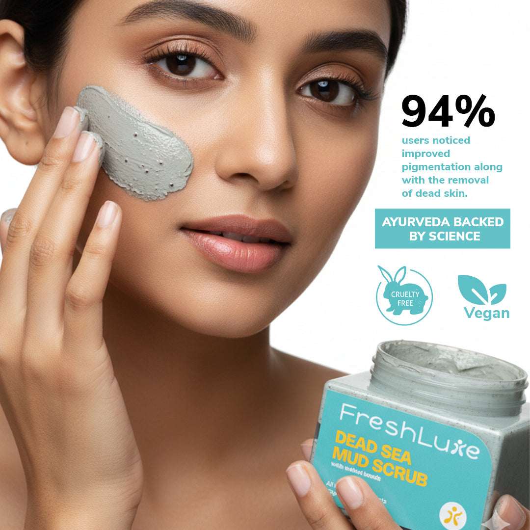 Woman applying FreshLuxe Dead Sea Mud Scrub to her face with product packaging displayed.