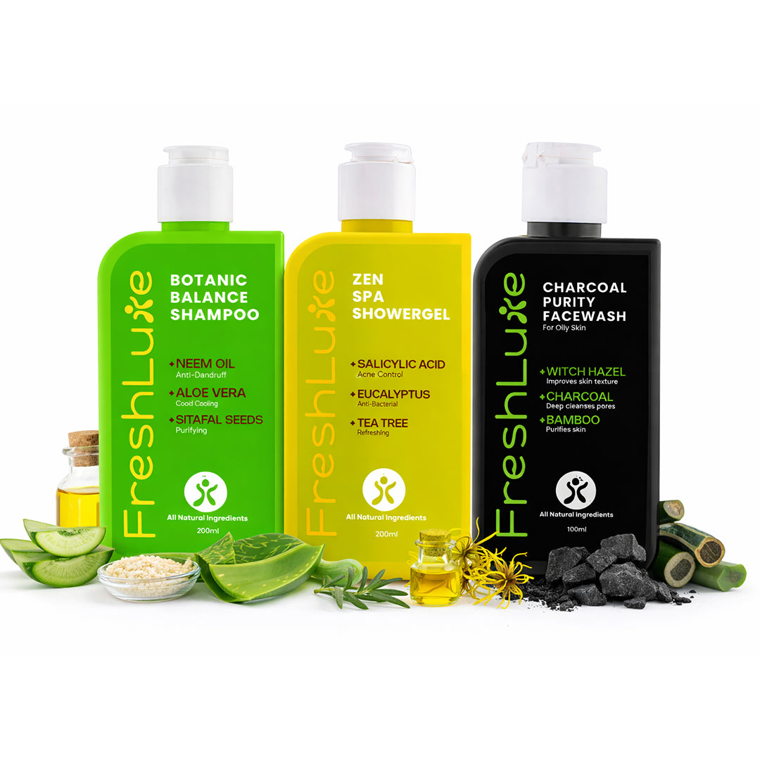 Three bottles of FreshLuxe skincare products on a white background with natural ingredients.