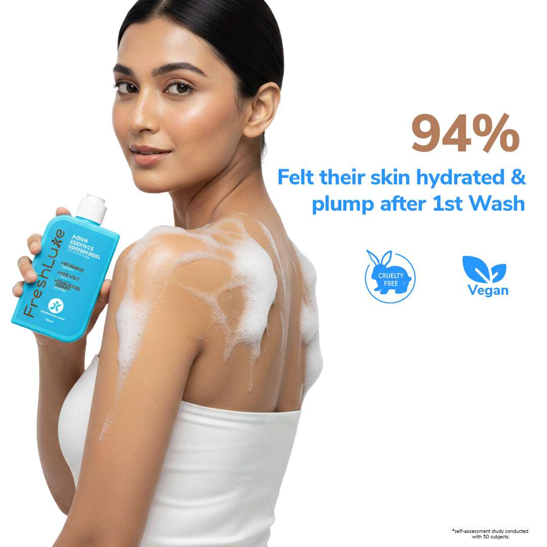 Woman with soap suds on her shoulders holding a bottle of FreshBlue product, with text about skin hydration.